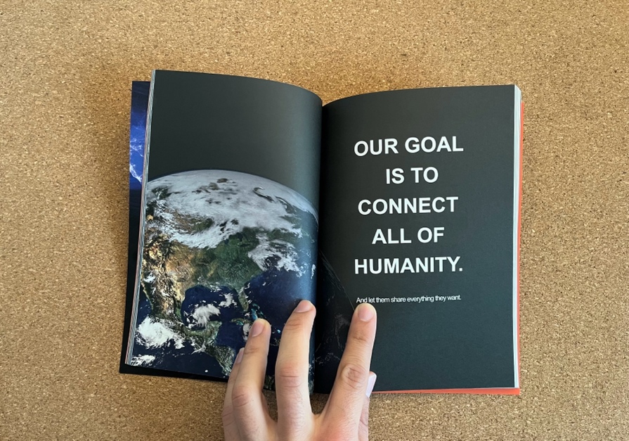 A hand holding a book Description automatically generated with medium confidence
